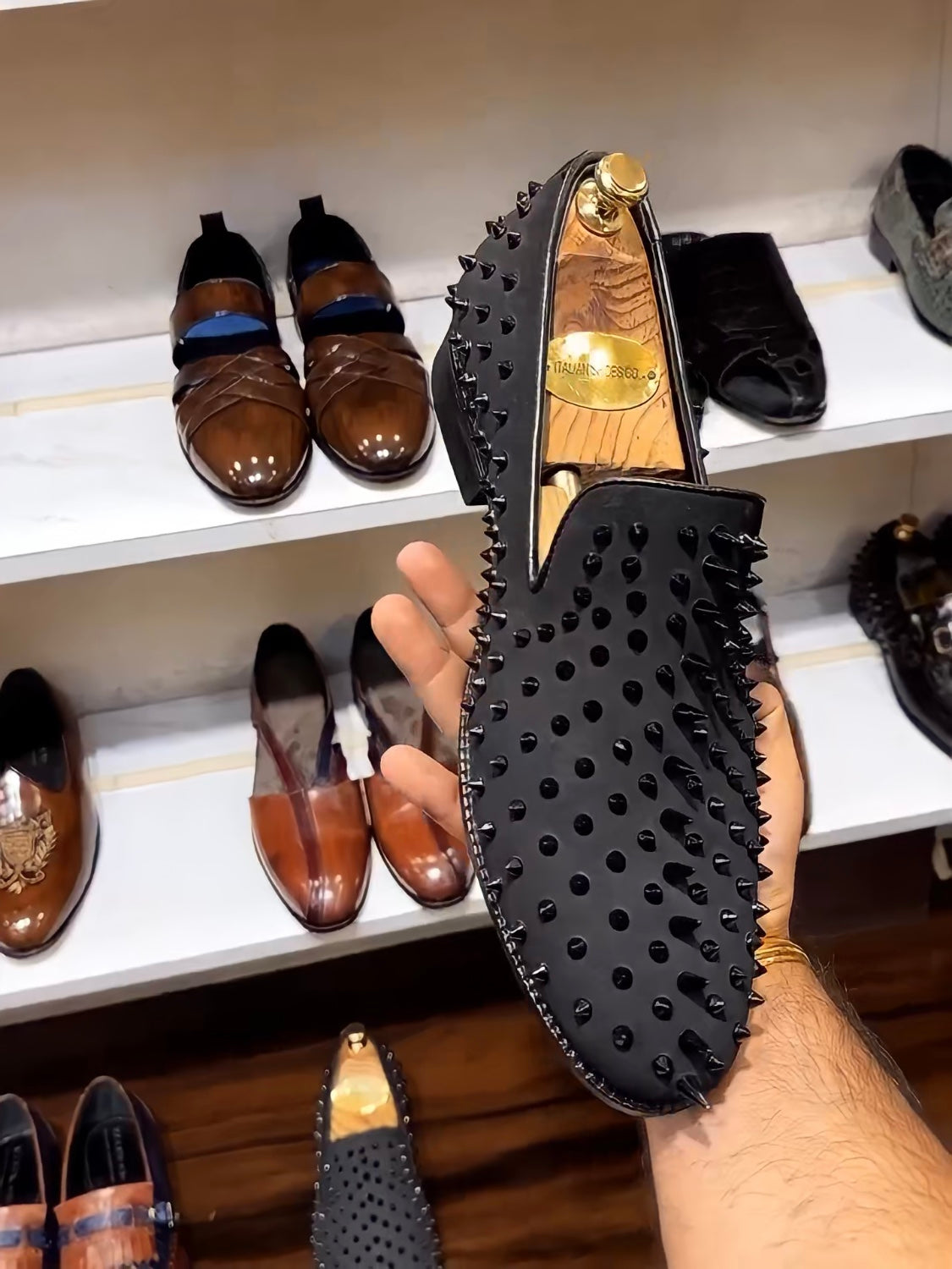 Black Studded Slip-ons with Red Bottoms