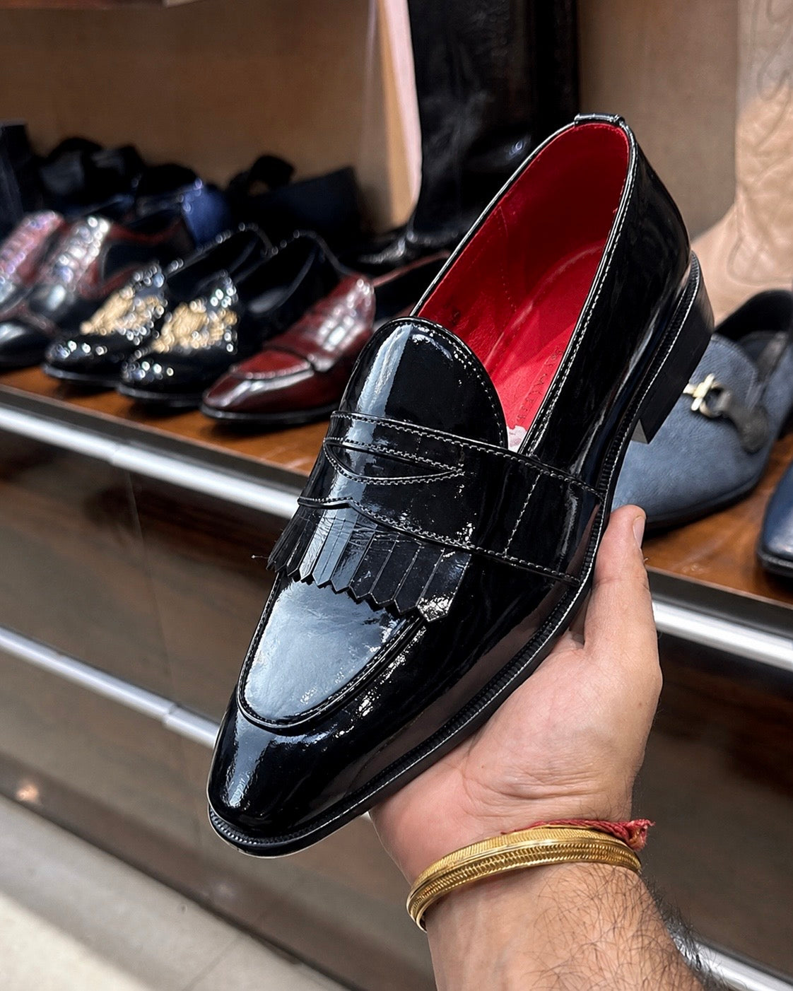 Black Patent Leather Fringe Penny Loafers With Red Interior