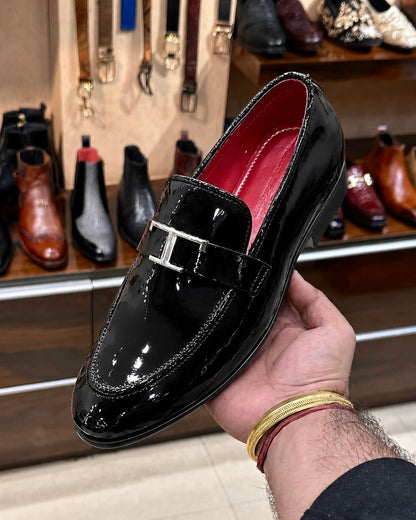 Black Patent Leather Loafers With Silver T Buckle And Red Interior