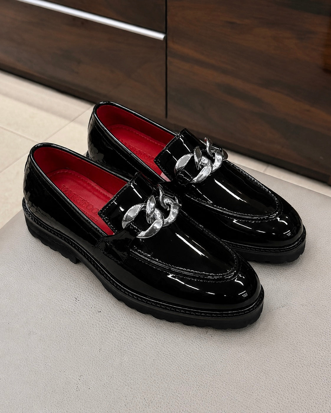 Black Patent Leather Silver Chain Buckle Loafers With Lug Sole And Red Interior