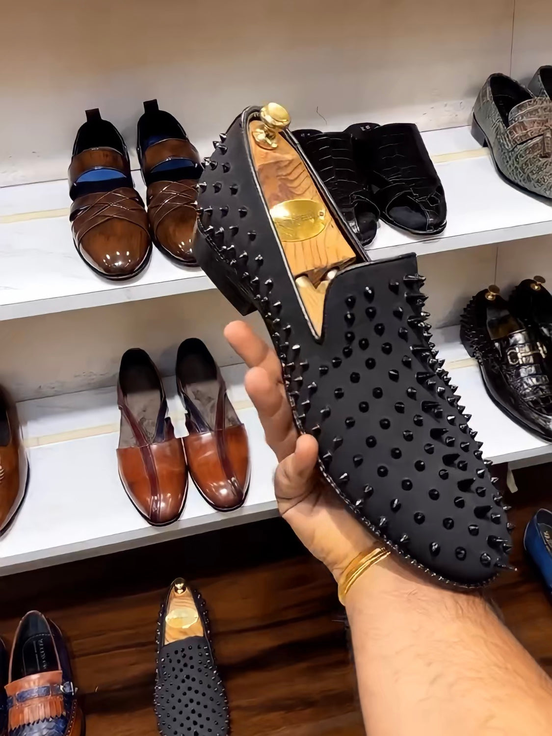 Black Studded Slip-ons with Red Bottoms
