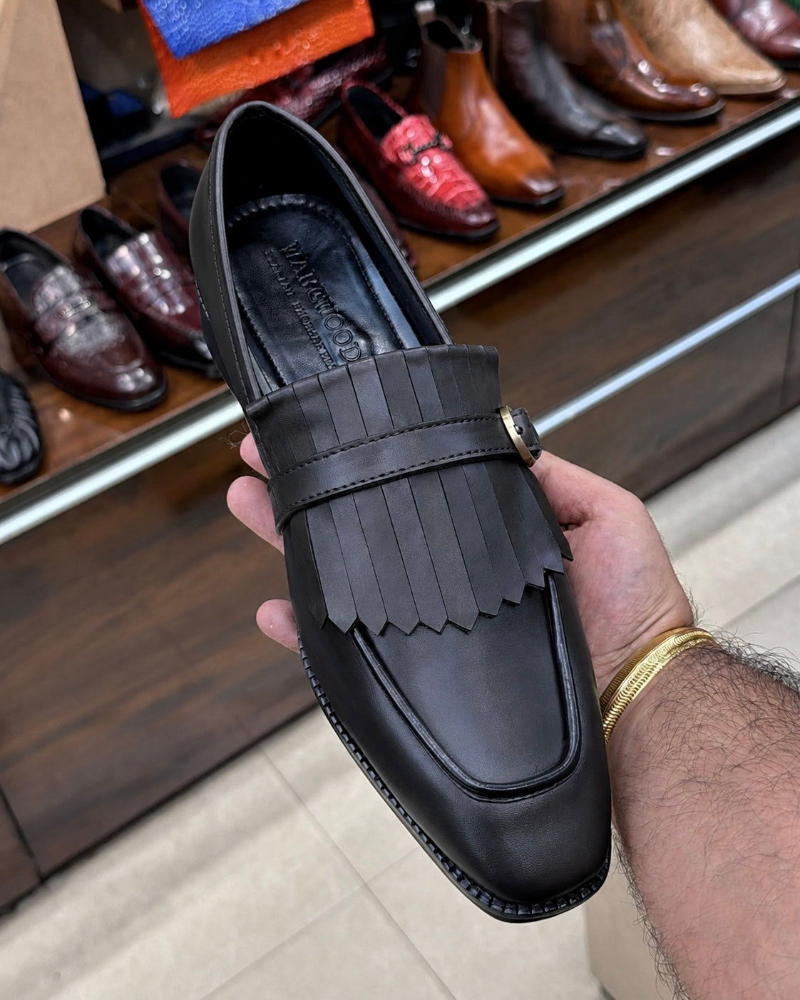Black Fringe Loafers With Gold Buckle