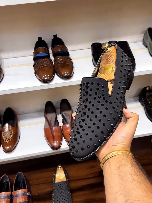 Black Studded Slip-ons with Red Bottoms
