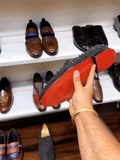 Black Studded Slip-ons with Red Bottoms