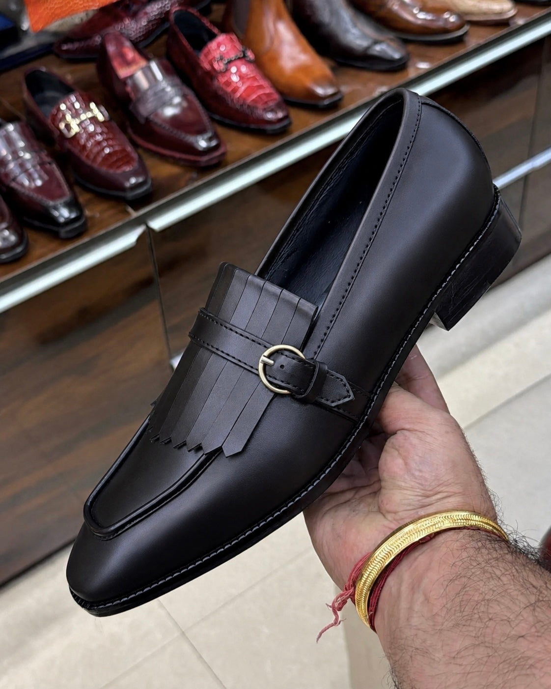 Black Fringe Loafers With Gold Buckle