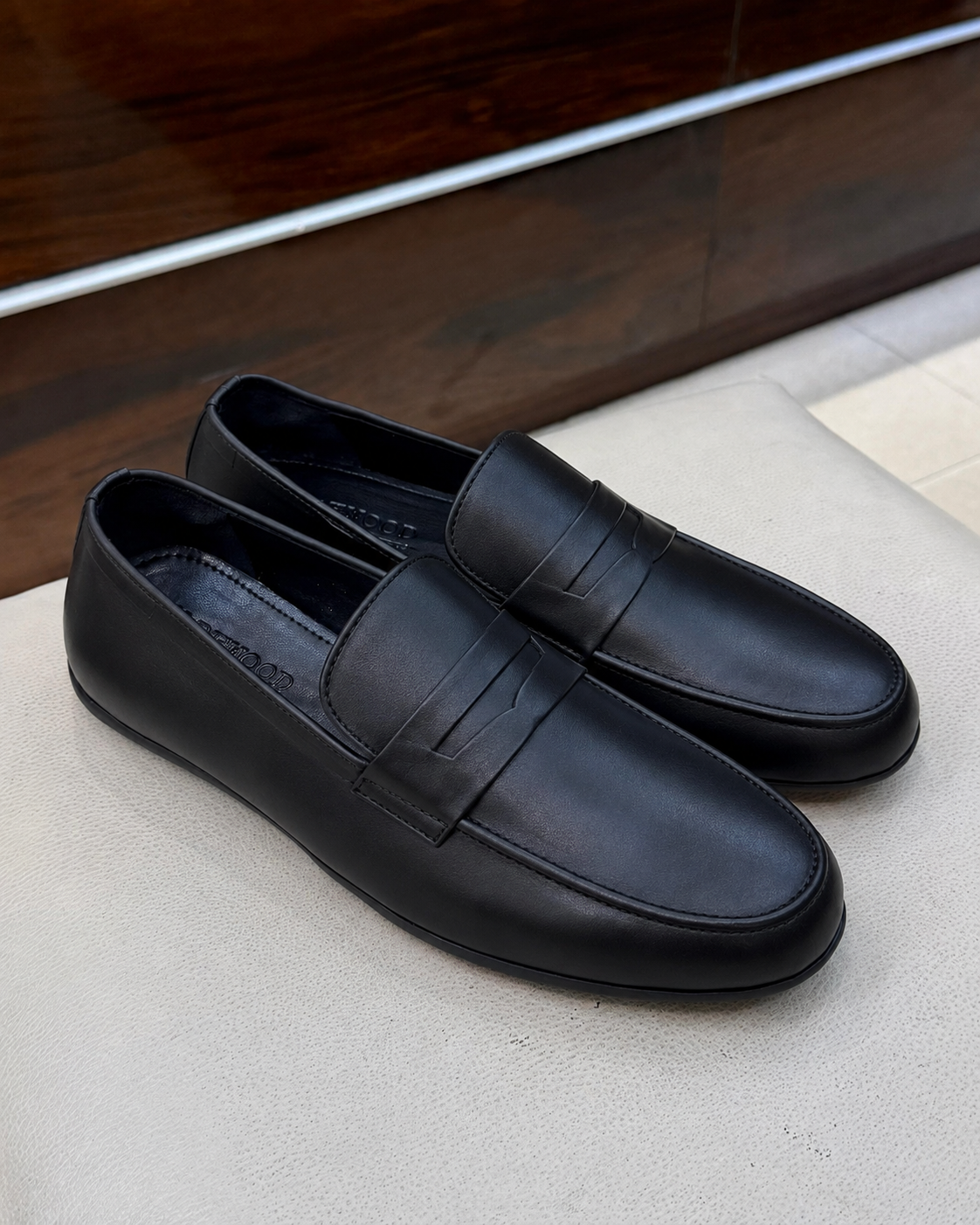 Black driving penny loafers
