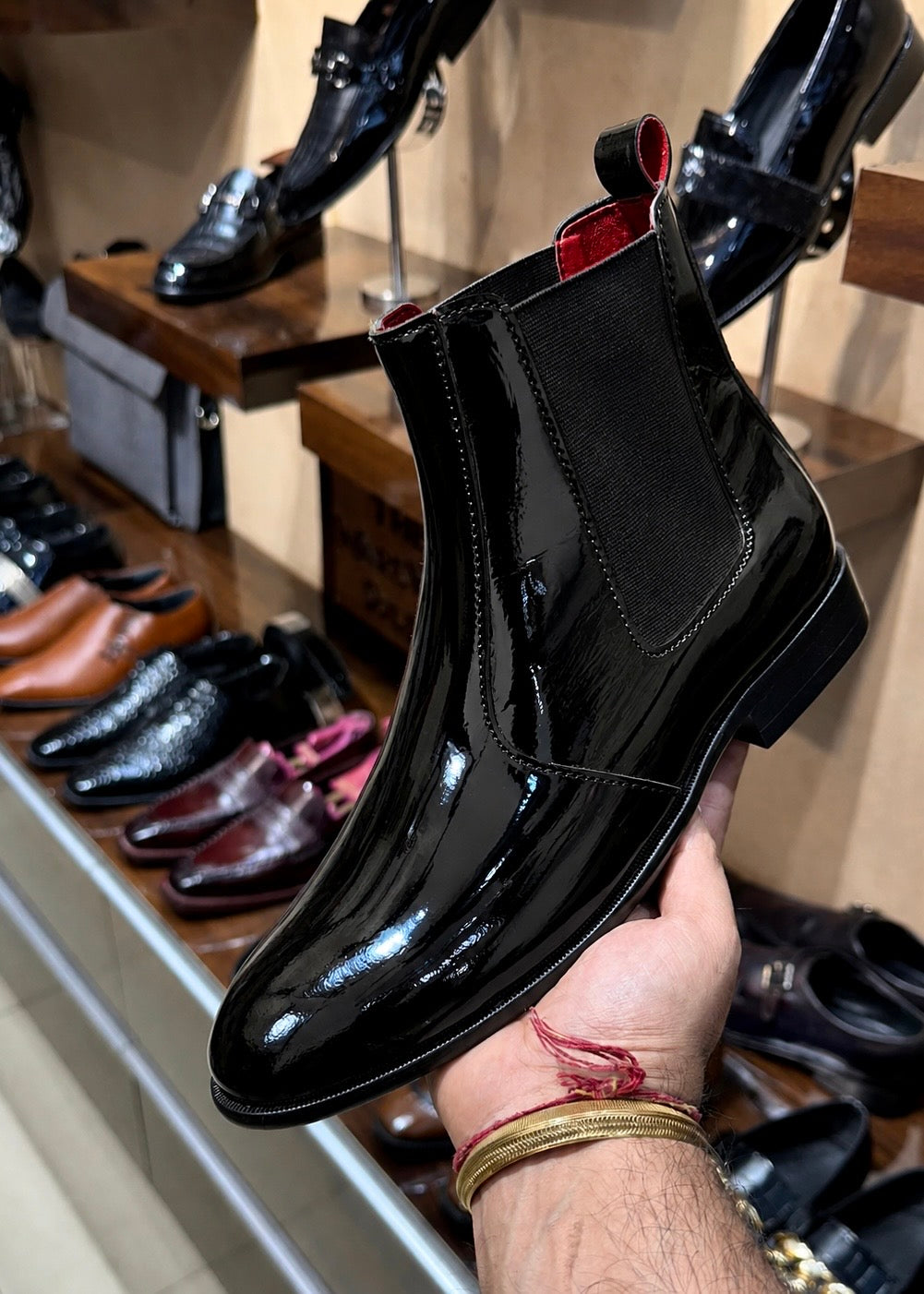 Black patent leather chelsea boots