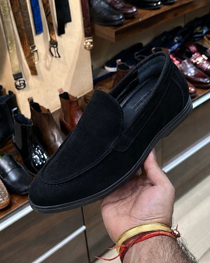 Black yacht loafers with a black sole