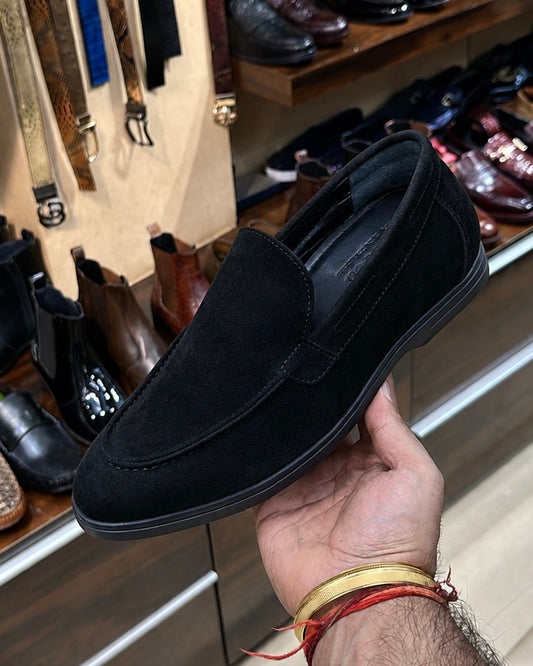 Black yacht loafers with a black sole