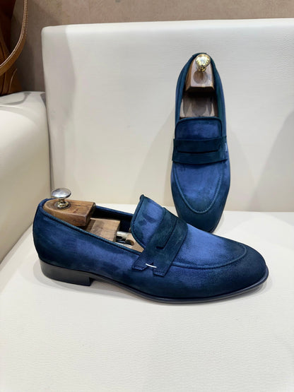 Blue suede penny loafers